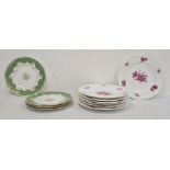 Seven 19th century china plates, puce decorated with naturalistic floral sprays including tulips and