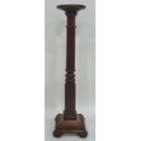 Mahogany aspidistra stand, the circular top with fluted, turned and block column, to square base, on