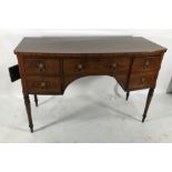 19th century mahogany sideboard the bowed front with five drawers, turned supports, peg feet, and