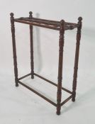 Late 19th/early 20th century stickstand on turned and ringed supports, 60cm x 76cm