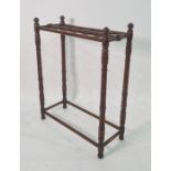 Late 19th/early 20th century stickstand on turned and ringed supports, 60cm x 76cm