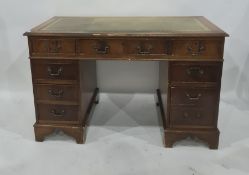 20th century pedestal desk with green leatherette inset top, nine drawers, on bracket feet, top