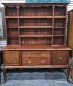 20th century dresser of assorted open shelves above base of two drawers and two cupboard doors,