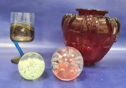 Red glass vase, shouldered with relief, trail decoration and panelled, two glass paperweights and