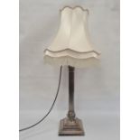 Large silver-plated corinthian column table lamp with ram's head detail, on square stepped base,