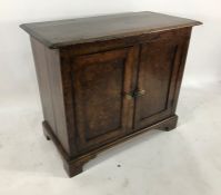 19th century burr walnut two-door cupboard, the rectangular pine top with burr walnut doors, on