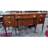 19th century mahogany breakfront sideboard with assorted drawers and cupboard doors, on turned and