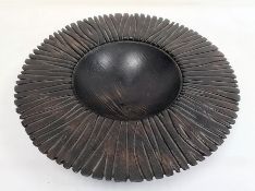 Dark wood carved sculptural bowl, circular with incised base and broad rim, 46cm wide
