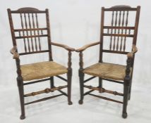 Pair of similar open arm rush-seated chairs having three tiers of turned spindles, rush seats,