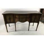 20th century mahahogany serpentine-fronted sideboard with two central drawers flanked by two
