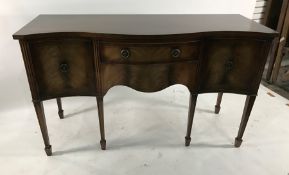 20th century mahahogany serpentine-fronted sideboard with two central drawers flanked by two