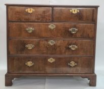 Georgian-style walnutwood chest of two short and three long graduated drawers with brass swan-neck