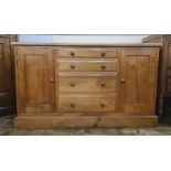 Modern cabinet/chest with four short drawers flanked by pair cupboards, 130cm wide x 59 deep x 76