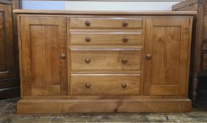 Modern cabinet/chest with four short drawers flanked by pair cupboards, 130cm wide x 59 deep x 76