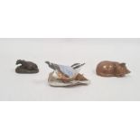 Brooks and Bentley bisque china model bird with leaves, carved wooden model cat and a bronze
