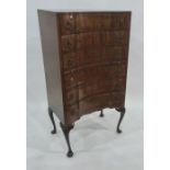 20th century mahogany serpentine front bedroom chest of six drawers with brushing slide, raised on