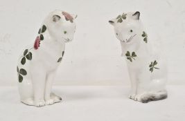 Two Plichta pottery model cats, one decorated with clover flowers and leaves 15cm high, the other