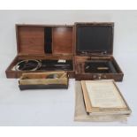 Ellams duplicator in stained wood case, a vintage metal surveyors tool in stained wood box and a