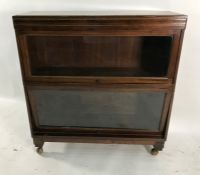 20th century Globe Wernicke-style bookcase with two glass doors, raised on castors, 85cm x 90cm