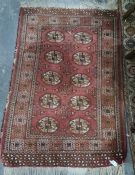 Eastern rug with 10 elephant foot guls to central field , 139 x 94 cm Condition ReportThere is