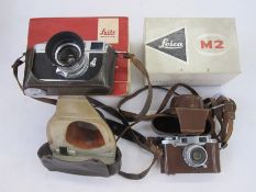 Leica M2-995 442 rangefinder camera, a Summaron lens serial number 1810648, an IROOA lens hood, in