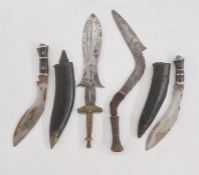 Two Gurkha kukri knives in leather sheaths and two African tribal knives  (4)