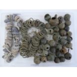 Quantity of medieval lead spindle-whorles, bronze crottle bells and rings