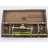 Brass theodolite by G Adams London in wooden fitted case, 53.5cm long Condition ReportCompass