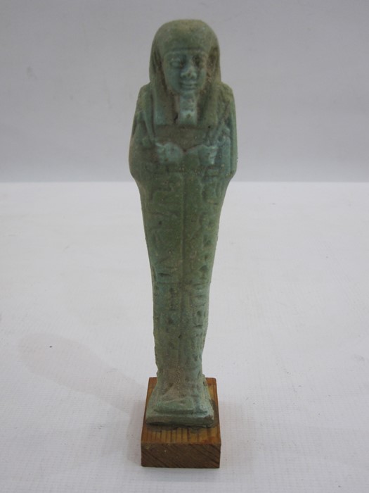 Egyptian blue glazed faience Ushabti in typical mummified form, with three lines of hieroglyphical