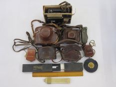 Voigtlander Vito B camera in brown leather case, an Exakta VX1000 camera in brown leather case, a