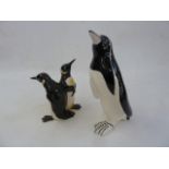 Beswick model penguin group,1015 and another ceramic model penguin  Part of the Wildfowl and