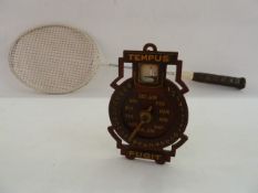 Vintage wooden painted perpetual Tempus Fugit calendar clock and a badminton racket
