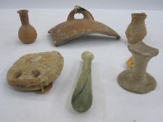 Roman terracotta loom weight, 9cm diameter approx, a small Roman glass bottle, 12.5cm high and