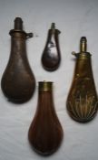 Embossed copper shot flask, and embossed brass shot flask, and two further shot flasks (4)