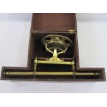 Brass theodolite by J Liford London, in wooden fitted case together with a tripod stand in