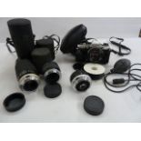 Olympus10 camera, cased, a Hoyer HMC Zoom 80-200mm 1:4 lens no.331954, a Hoyer Auto Teleconverter 3x