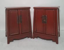 Pair of modern red lacquer Chinese-style bedside cabinets, the rectangular tops with rounded corners