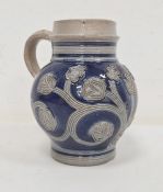 17th century Westerwald stoneware jug circa 1690-1700, with underglaze blue and incised tulip and