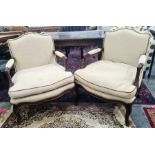 Two modern French-style arm chairs in French linen, with carved mahogany frames (2)