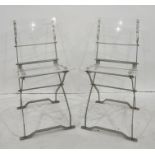 Four folding perspex and metal-framed chairs (4)