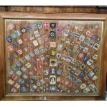 Large framed collection of various badges to include German, Great Britain, Italian and other