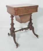 Victorian walnut games/work table, the rectangular swivel top with rounded front corners, opening to