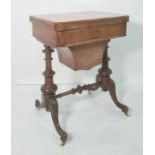 Victorian walnut games/work table, the rectangular swivel top with rounded front corners, opening to