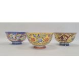 Set of three contemporary Chinese porcelain bowls, two with yellow ground and one with all-over
