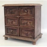 Miniature chest of six short drawers, rectangular top with moulded edge, the whole raised on