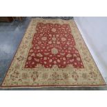 Modern machine-made rug, red ground with foliate pattern, cream ground border, 303 x 245cm