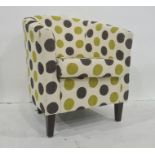 Modern armchair, cream ground with black and green spots