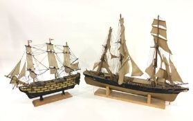 Painted wood model of HMS Victory, 50cm wide and model of three-masted sailing ship, 75cm wide (2)