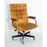 Office swivel chair in tan leather button back upholstery, chrome swivel base