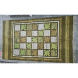 Modern rug with chess board pattern in cream, orange and green, stepped border, 168 x 101cm